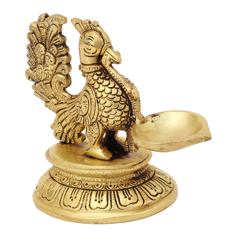 Brass peacock parrot Diya - exquisitely crafted brass oil lamp in the shape of a peacock with parrot motifs, golden finish, decorative home accent, fusion of elegance and vibrancy, traditional Indian Diya, emits a captivating and auspicious glow, perfect for festive occasions and religious ceremonies, enhances spiritual ambiance and decor with a touch of artistic brilliance.