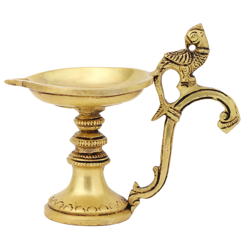 Brass peacock parrot Diya - exquisitely crafted brass oil lamp in the shape of a peacock with parrot motifs, golden finish, decorative home accent, fusion of elegance and vibrancy, traditional Indian Diya, emits a captivating and auspicious glow, perfect for festive occasions and religious ceremonies, enhances spiritual ambiance and decor with a touch of artistic brilliance.