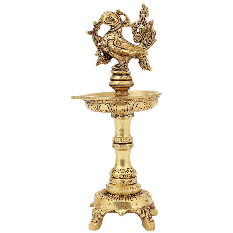 Brass peacock parrot Diya - exquisitely crafted brass oil lamp in the shape of a peacock with parrot motifs, golden finish, decorative home accent, fusion of elegance and vibrancy, traditional Indian Diya, emits a captivating and auspicious glow, perfect for festive occasions and religious ceremonies, enhances spiritual ambiance and decor with a touch of artistic brilliance.