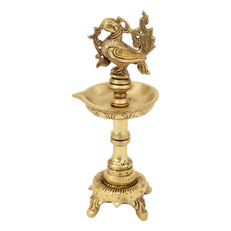 Brass peacock parrot Diya - exquisitely crafted brass oil lamp in the shape of a peacock with parrot motifs, golden finish, decorative home accent, fusion of elegance and vibrancy, traditional Indian Diya, emits a captivating and auspicious glow, perfect for festive occasions and religious ceremonies, enhances spiritual ambiance and decor with a touch of artistic brilliance.