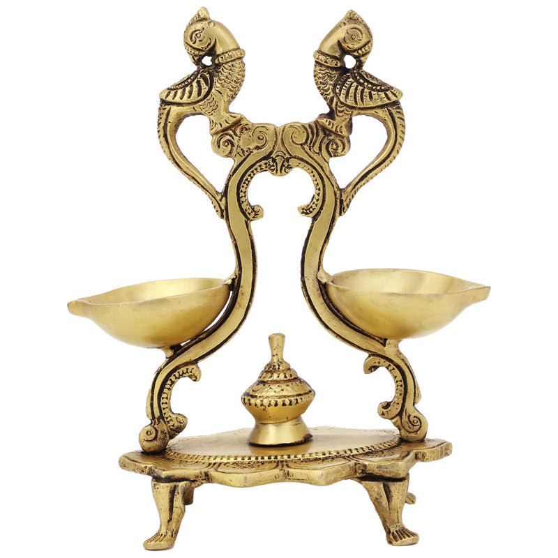 Brass peacock parrot Diya - exquisitely crafted brass oil lamp in the shape of a peacock with parrot motifs, golden finish, decorative home accent, fusion of elegance and vibrancy, traditional Indian Diya, emits a captivating and auspicious glow, perfect for festive occasions and religious ceremonies, enhances spiritual ambiance and decor with a touch of artistic brilliance.