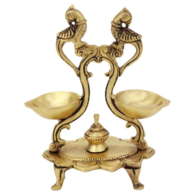 Brass peacock parrot Diya - exquisitely crafted brass oil lamp in the shape of a peacock with parrot motifs, golden finish, decorative home accent, fusion of elegance and vibrancy, traditional Indian Diya, emits a captivating and auspicious glow, perfect for festive occasions and religious ceremonies, enhances spiritual ambiance and decor with a touch of artistic brilliance.