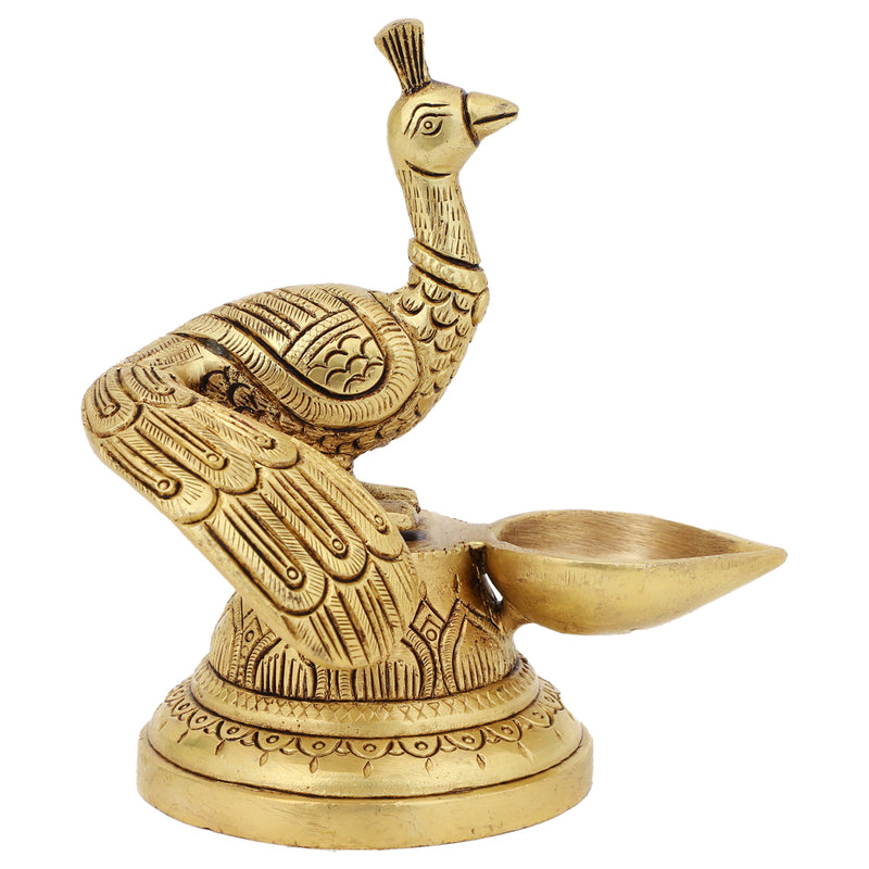 Brass peacock parrot Diya - exquisitely crafted brass oil lamp in the shape of a peacock with parrot motifs, golden finish, decorative home accent, fusion of elegance and vibrancy, traditional Indian Diya, emits a captivating and auspicious glow, perfect for festive occasions and religious ceremonies, enhances spiritual ambiance and decor with a touch of artistic brilliance.