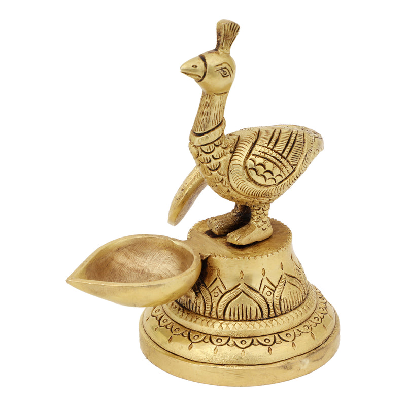 Brass peacock parrot Diya - exquisitely crafted brass oil lamp in the shape of a peacock with parrot motifs, golden finish, decorative home accent, fusion of elegance and vibrancy, traditional Indian Diya, emits a captivating and auspicious glow, perfect for festive occasions and religious ceremonies, enhances spiritual ambiance and decor with a touch of artistic brilliance.