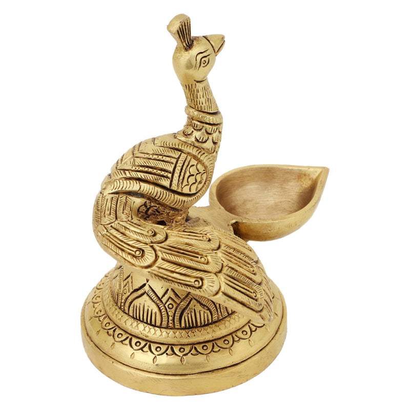 Brass peacock parrot Diya - exquisitely crafted brass oil lamp in the shape of a peacock with parrot motifs, golden finish, decorative home accent, fusion of elegance and vibrancy, traditional Indian Diya, emits a captivating and auspicious glow, perfect for festive occasions and religious ceremonies, enhances spiritual ambiance and decor with a touch of artistic brilliance.