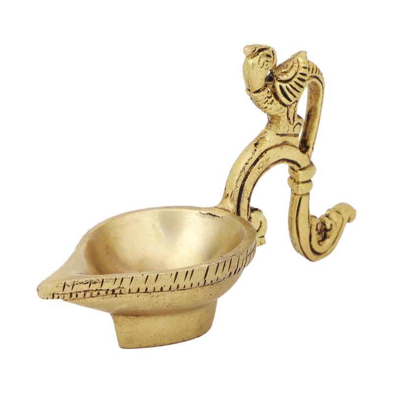 Brass peacock parrot Diya - exquisitely crafted brass oil lamp in the shape of a peacock with parrot motifs, golden finish, decorative home accent, fusion of elegance and vibrancy, traditional Indian Diya, emits a captivating and auspicious glow, perfect for festive occasions and religious ceremonies, enhances spiritual ambiance and decor with a touch of artistic brilliance.