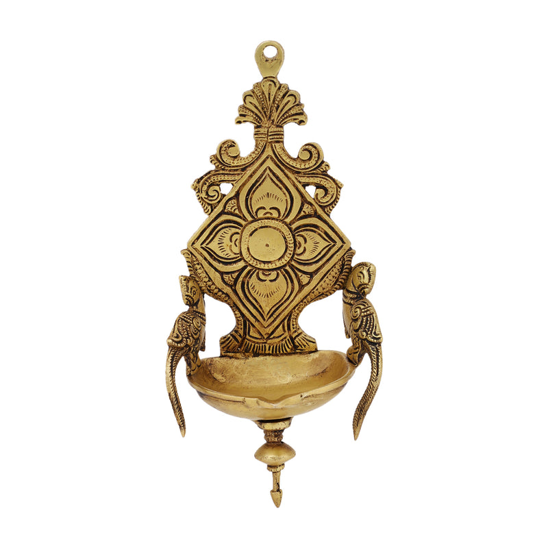 Brass Wall Diya - intricately designed brass oil lamp for wall mounting, golden finish, decorative home accent, traditional Indian Diya, emits a warm and inviting glow, ideal for enhancing wall decor and creating an ambiance of serenity, perfect for religious ceremonies and festive occasions, adds a touch of traditional charm to interior spaces.