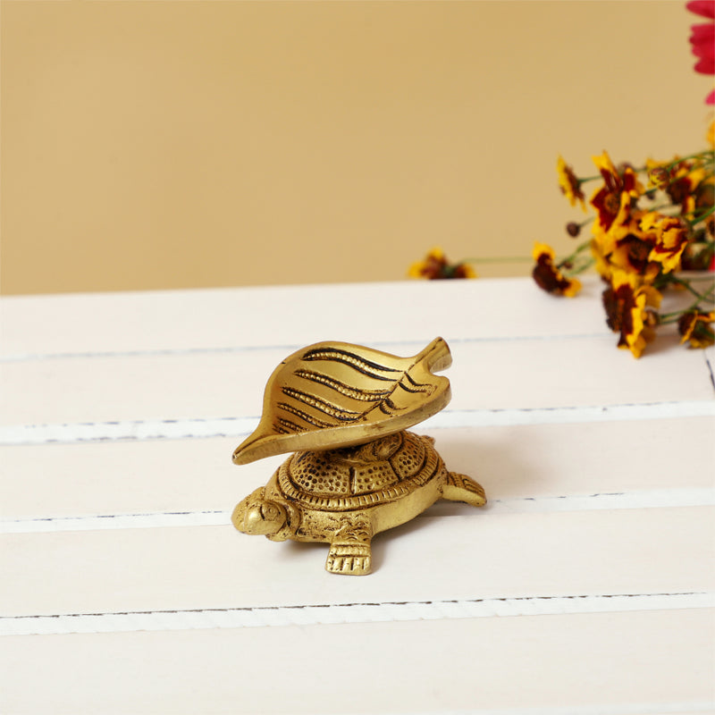 Brass small Akhand Turtle Diya - intricately designed brass oil lamp, compact size, traditional Indian Diya, golden finish, decorative home accent, emits a warm and serene glow, ideal for religious ceremonies and meditation, enhances spiritual ambiance and decor.