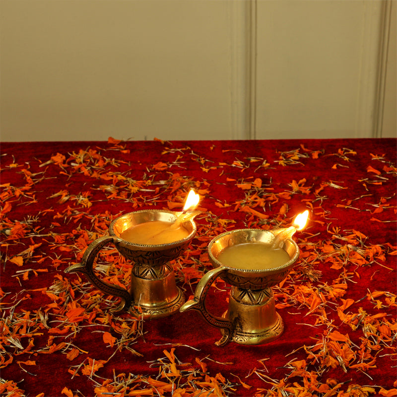 Brass small Akhand Diya - intricately designed brass oil lamp, compact size, traditional Indian Diya, golden finish, decorative home accent, emits a warm and serene glow, ideal for religious ceremonies and meditation, enhances spiritual ambiance and decor.