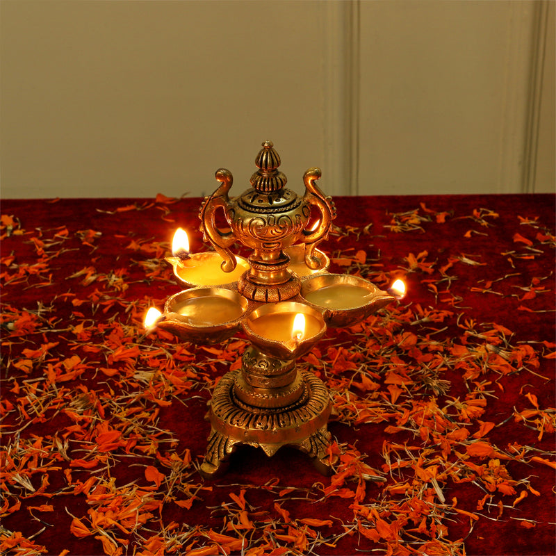 Brass Diya - exquisitely crafted brass oil lamp, traditional design, golden finish, decorative home accent, symbolizes spirituality and enlightenment, emits a warm and tranquil glow, ideal for religious ceremonies and festive occasions, enhances ambiance and decor with a touch of traditional elegance.