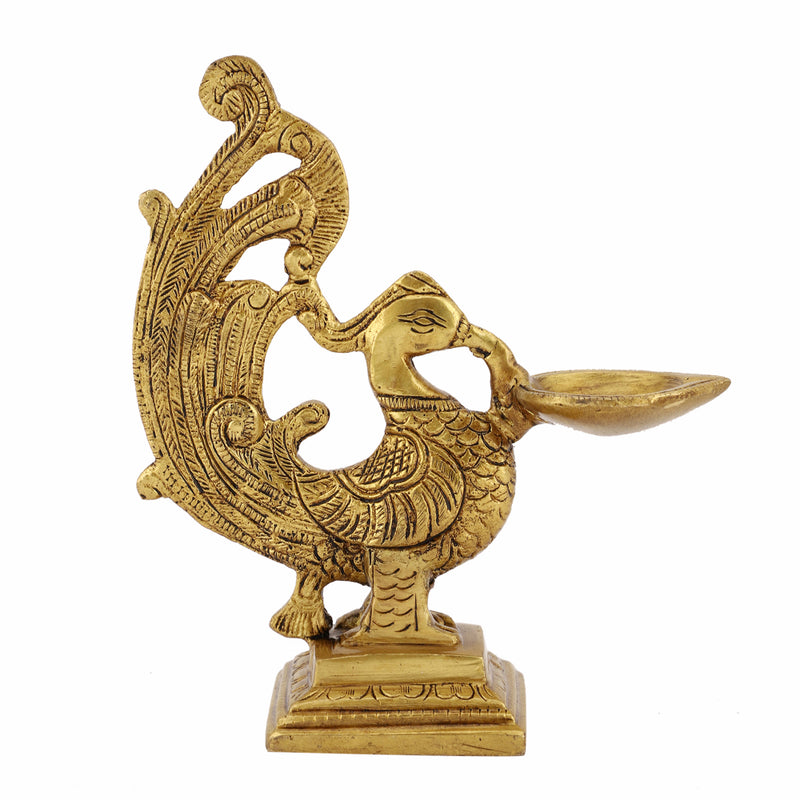 Brass peacock parrot Diya - exquisitely crafted brass oil lamp in the shape of a peacock with parrot motifs, golden finish, decorative home accent, fusion of elegance and vibrancy, traditional Indian Diya, emits a captivating and auspicious glow, perfect for festive occasions and religious ceremonies, enhances spiritual ambiance and decor with a touch of artistic brilliance.