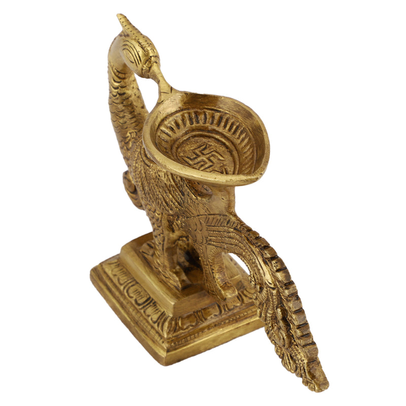 Brass peacock parrot Diya - exquisitely crafted brass oil lamp in the shape of a peacock with parrot motifs, golden finish, decorative home accent, fusion of elegance and vibrancy, traditional Indian Diya, emits a captivating and auspicious glow, perfect for festive occasions and religious ceremonies, enhances spiritual ambiance and decor with a touch of artistic brilliance.