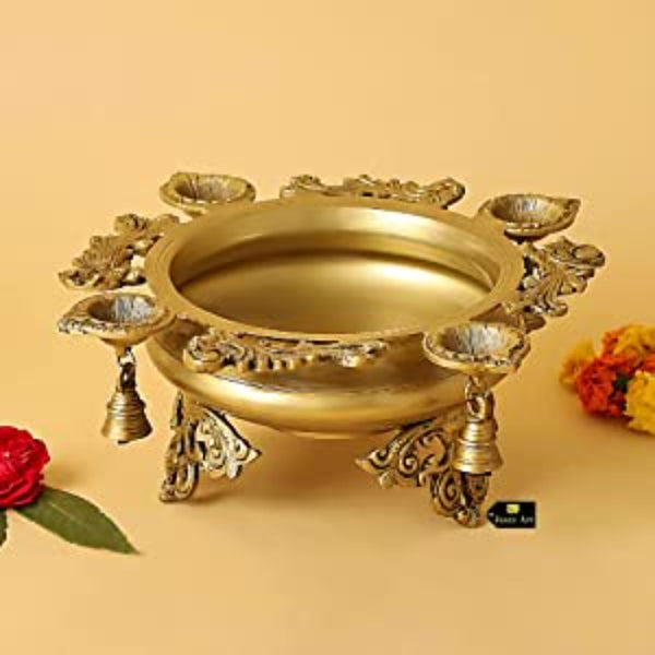 Brass 4 Diya Urli - beautifully crafted brass decorative bowl with four diya (oil lamp) holders, golden finish, traditional Indian Urli, versatile home accent, ideal for lighting multiple diya simultaneously, adds a touch of warmth and radiance to any space, perfect for creating a festive ambiance and enhancing interior decor, a charming centerpiece for religious ceremonies and celebratory occasions.