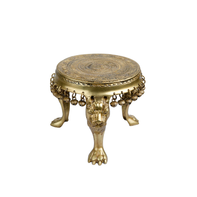 Brass Chowki - intricately carved brass platform, golden finish, perfect for placing deities or sacred objects during religious ceremonies and rituals, enhances the sanctity and beauty of the worship space, symbolizes stability and divine presence, adds a touch of elegance to your home puja setup, a valuable and ornamental addition to your collection of brass religious artifacts and decor.