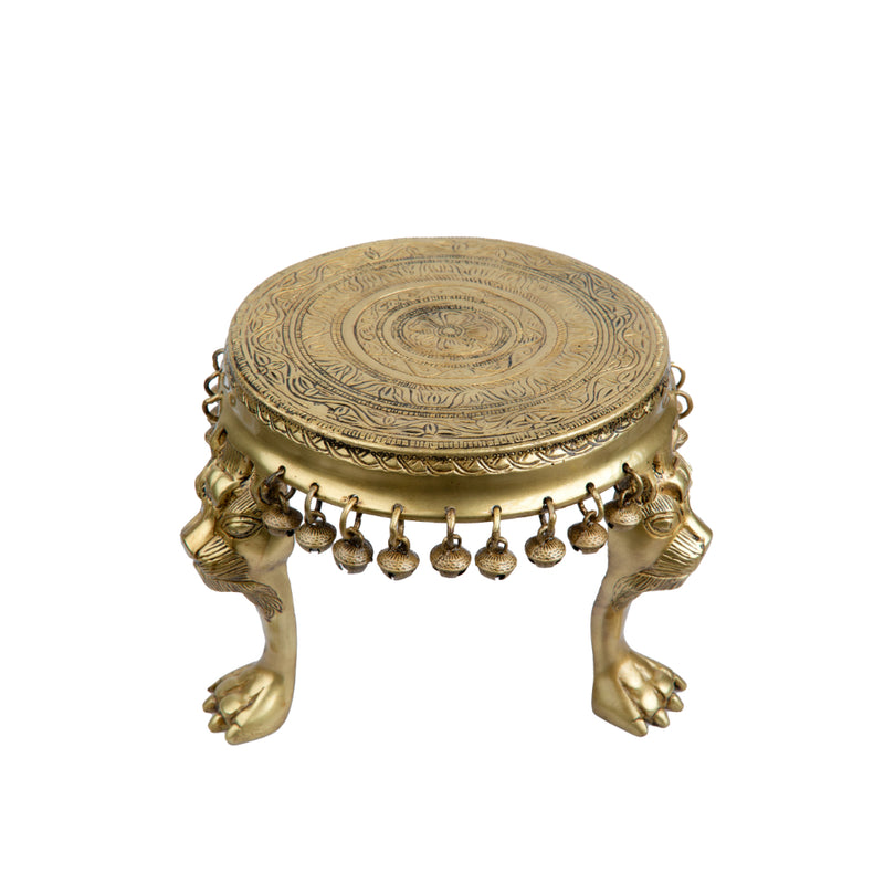 Brass Chowki - intricately carved brass platform, golden finish, perfect for placing deities or sacred objects during religious ceremonies and rituals, enhances the sanctity and beauty of the worship space, symbolizes stability and divine presence, adds a touch of elegance to your home puja setup, a valuable and ornamental addition to your collection of brass religious artifacts and decor.