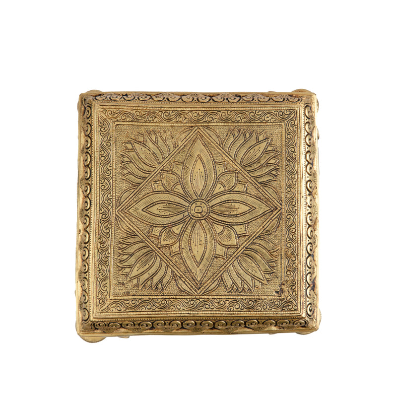 Brass Chowki - intricately carved brass platform, golden finish, perfect for placing deities or sacred objects during religious ceremonies and rituals, enhances the sanctity and beauty of the worship space, symbolizes stability and divine presence, adds a touch of elegance to your home puja setup, a valuable and ornamental addition to your collection of brass religious artifacts and decor.