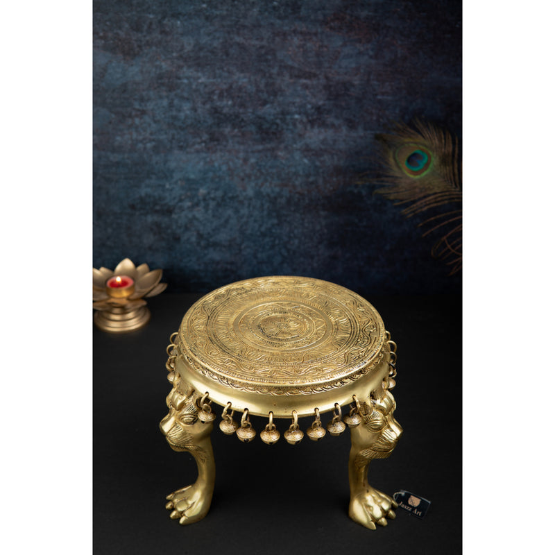 Brass Chowki - intricately carved brass platform, golden finish, perfect for placing deities or sacred objects during religious ceremonies and rituals, enhances the sanctity and beauty of the worship space, symbolizes stability and divine presence, adds a touch of elegance to your home puja setup, a valuable and ornamental addition to your collection of brass religious artifacts and decor.