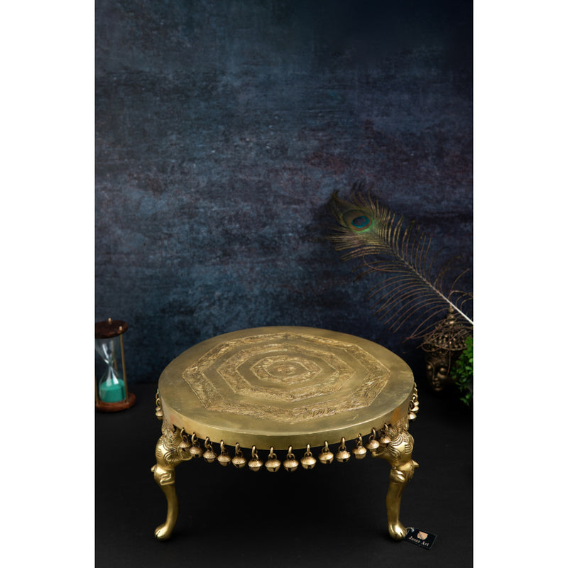 Brass Chowki - intricately carved brass platform, golden finish, perfect for placing deities or sacred objects during religious ceremonies and rituals, enhances the sanctity and beauty of the worship space, symbolizes stability and divine presence, adds a touch of elegance to your home puja setup, a valuable and ornamental addition to your collection of brass religious artifacts and decor.