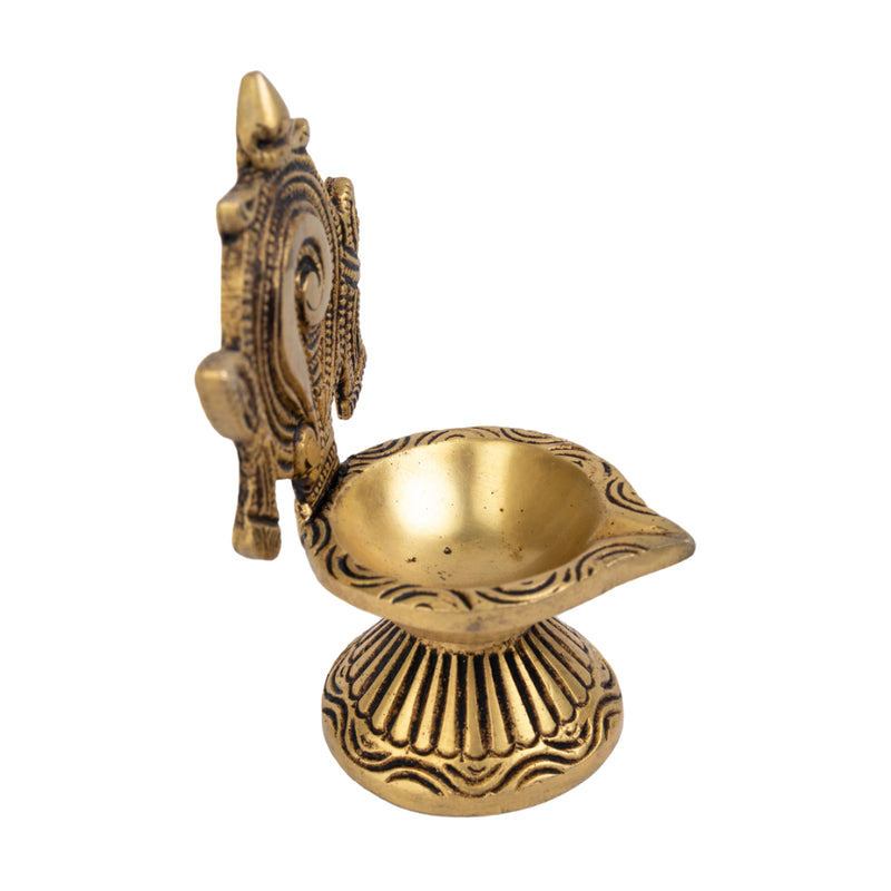 Brass Shank Diya - intricately designed brass oil lamp in the shape of a conch shell, golden finish, decorative home accent, symbolizes purity and spirituality, traditional Indian Diya, emits a radiant and calming glow, perfect for religious ceremonies and meditation, enhances spiritual ambiance and decor with a touch of serenity.