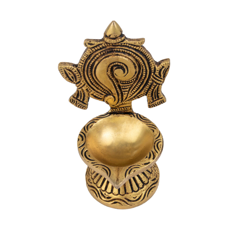 Brass Shank Diya - intricately designed brass oil lamp in the shape of a conch shell, golden finish, decorative home accent, symbolizes purity and spirituality, traditional Indian Diya, emits a radiant and calming glow, perfect for religious ceremonies and meditation, enhances spiritual ambiance and decor with a touch of serenity.