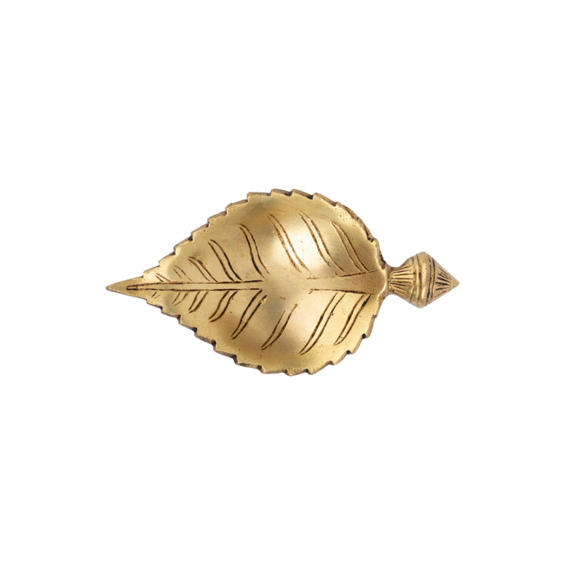 Brass Leaf Diya - elegantly crafted brass oil lamp in the shape of a leaf, golden finish, decorative home accent, inspired by nature's beauty, traditional Indian Diya, emits a soft and serene glow, ideal for religious ceremonies and festive occasions, enhances spiritual ambiance and decor with a touch of natural charm.