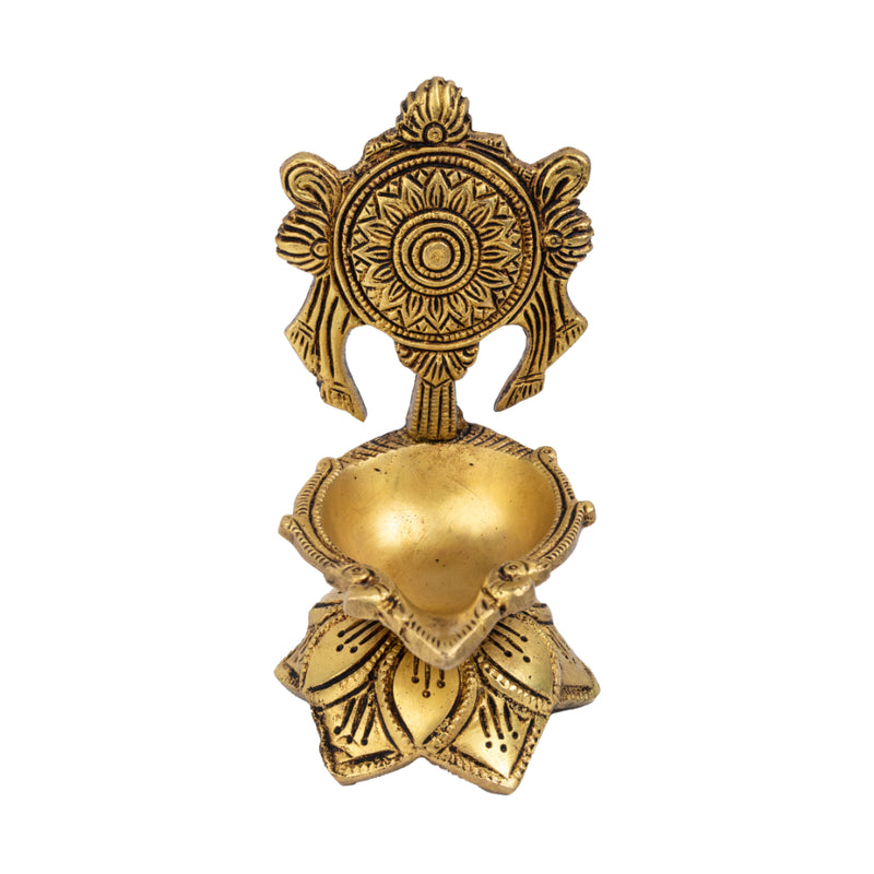 Brass Chakra Diya - beautifully crafted brass oil lamp with Chakra design, golden finish, decorative home accent, traditional Indian Diya, symbolizes spiritual energy and balance, emits a radiant and peaceful glow, perfect for rituals and meditation, enhances spiritual ambiance and decor