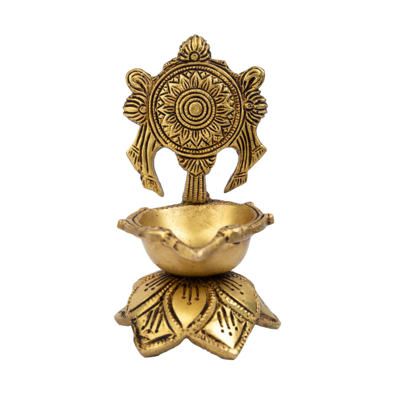 Brass Chakra Diya - beautifully crafted brass oil lamp with Chakra design, golden finish, decorative home accent, traditional Indian Diya, symbolizes spiritual energy and balance, emits a radiant and peaceful glow, perfect for rituals and meditation, enhances spiritual ambiance and decor