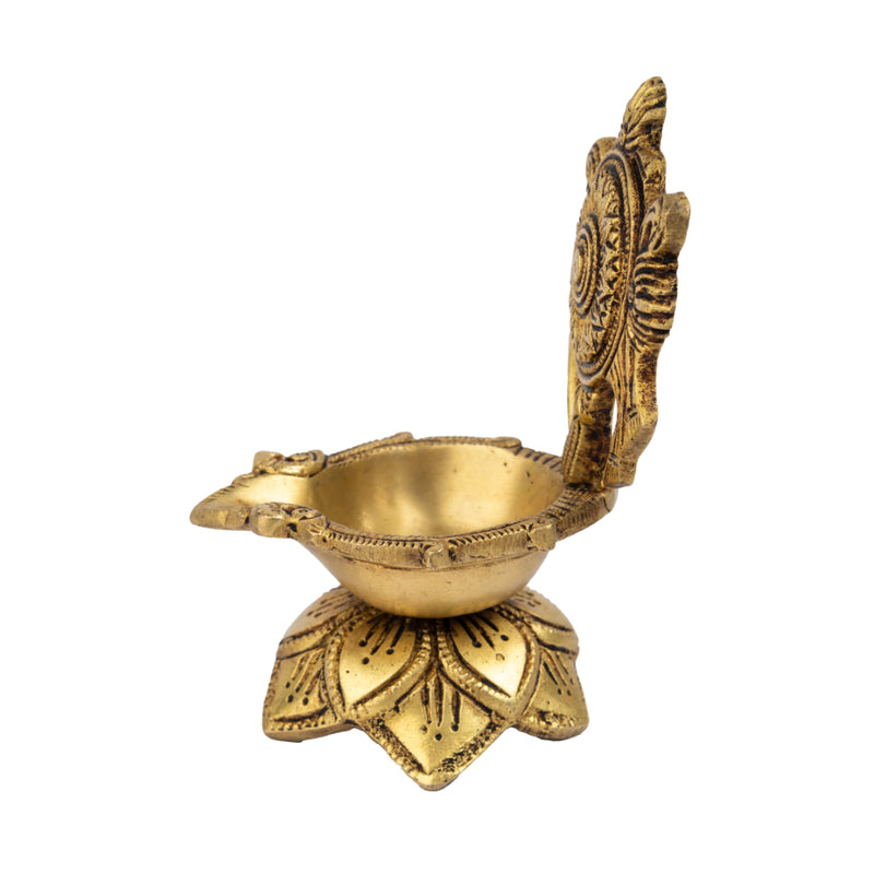 Brass Chakra Diya - beautifully crafted brass oil lamp with Chakra design, golden finish, decorative home accent, traditional Indian Diya, symbolizes spiritual energy and balance, emits a radiant and peaceful glow, perfect for rituals and meditation, enhances spiritual ambiance and decor