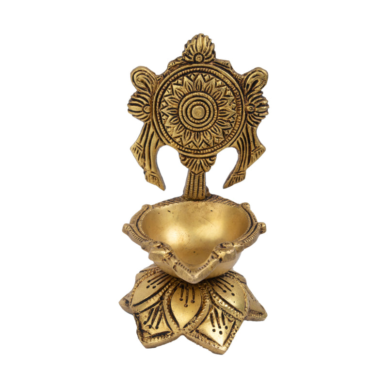 Brass Chakra Diya - beautifully crafted brass oil lamp with Chakra design, golden finish, decorative home accent, traditional Indian Diya, symbolizes spiritual energy and balance, emits a radiant and peaceful glow, perfect for rituals and meditation, enhances spiritual ambiance and decor