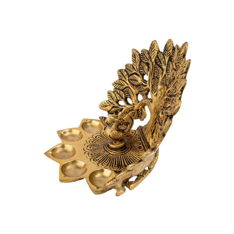 Brass Tree Diya - meticulously designed brass oil lamp in the shape of a tree, golden finish, decorative home accent, symbolizes growth and prosperity, traditional Indian Diya, emits a warm and radiant glow, perfect for festive celebrations and spiritual rituals, enhances spiritual ambiance and decor with a touch of natural beauty.