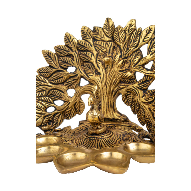 Brass Tree Diya - meticulously designed brass oil lamp in the shape of a tree, golden finish, decorative home accent, symbolizes growth and prosperity, traditional Indian Diya, emits a warm and radiant glow, perfect for festive celebrations and spiritual rituals, enhances spiritual ambiance and decor with a touch of natural beauty.