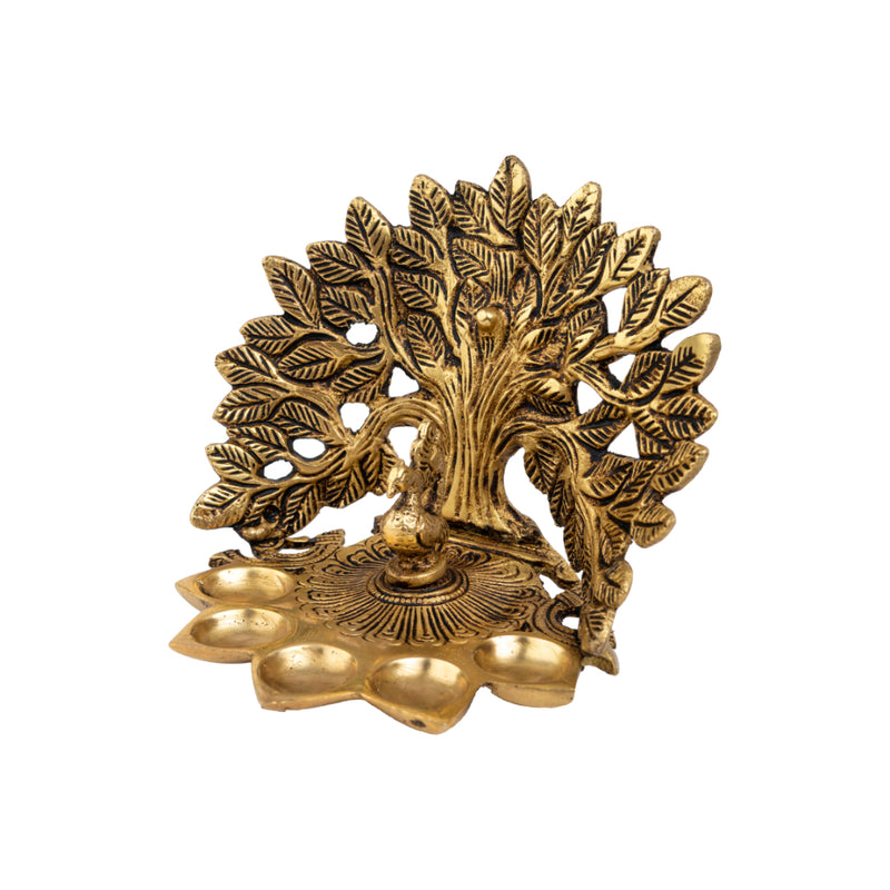 Brass Tree Diya - meticulously designed brass oil lamp in the shape of a tree, golden finish, decorative home accent, symbolizes growth and prosperity, traditional Indian Diya, emits a warm and radiant glow, perfect for festive celebrations and spiritual rituals, enhances spiritual ambiance and decor with a touch of natural beauty.