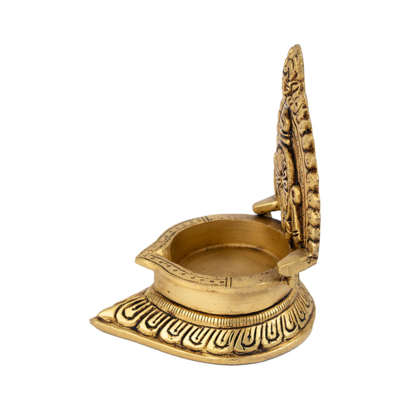 Brass Chakra Diya - beautifully crafted brass oil lamp with Chakra design, golden finish, decorative home accent, traditional Indian Diya, symbolizes spiritual energy and balance, emits a radiant and peaceful glow, perfect for rituals and meditation, enhances spiritual ambiance and decor