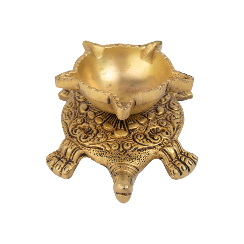 Brass small Akhand Turtle Diya - intricately designed brass oil lamp, compact size, traditional Indian Diya, golden finish, decorative home accent, emits a warm and serene glow, ideal for religious ceremonies and meditation, enhances spiritual ambiance and decor.