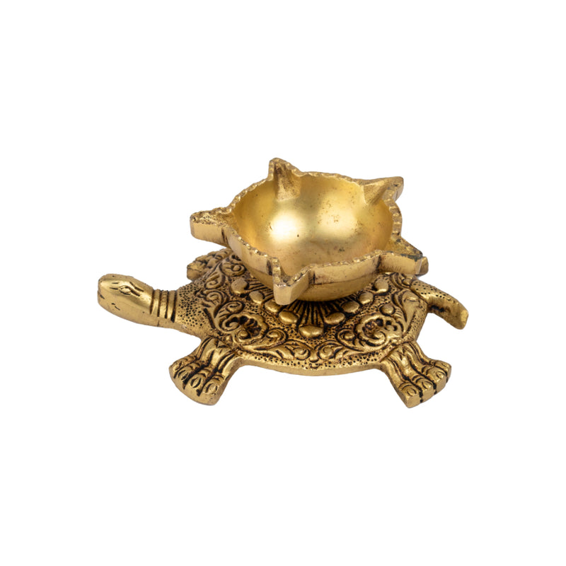 Brass small Akhand Turtle Diya - intricately designed brass oil lamp, compact size, traditional Indian Diya, golden finish, decorative home accent, emits a warm and serene glow, ideal for religious ceremonies and meditation, enhances spiritual ambiance and decor.