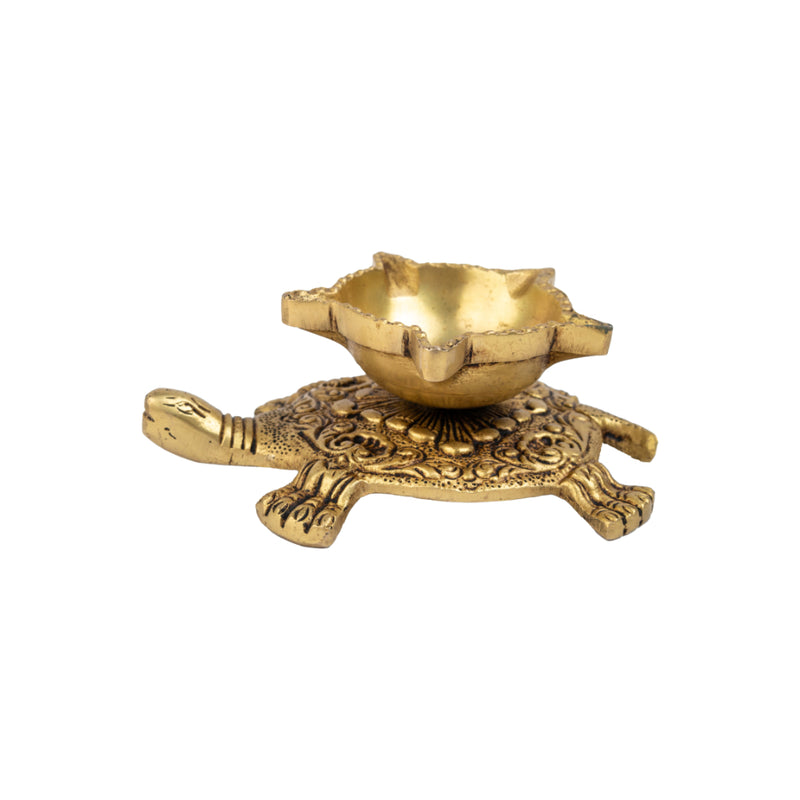 Brass small Akhand Turtle Diya - intricately designed brass oil lamp, compact size, traditional Indian Diya, golden finish, decorative home accent, emits a warm and serene glow, ideal for religious ceremonies and meditation, enhances spiritual ambiance and decor.