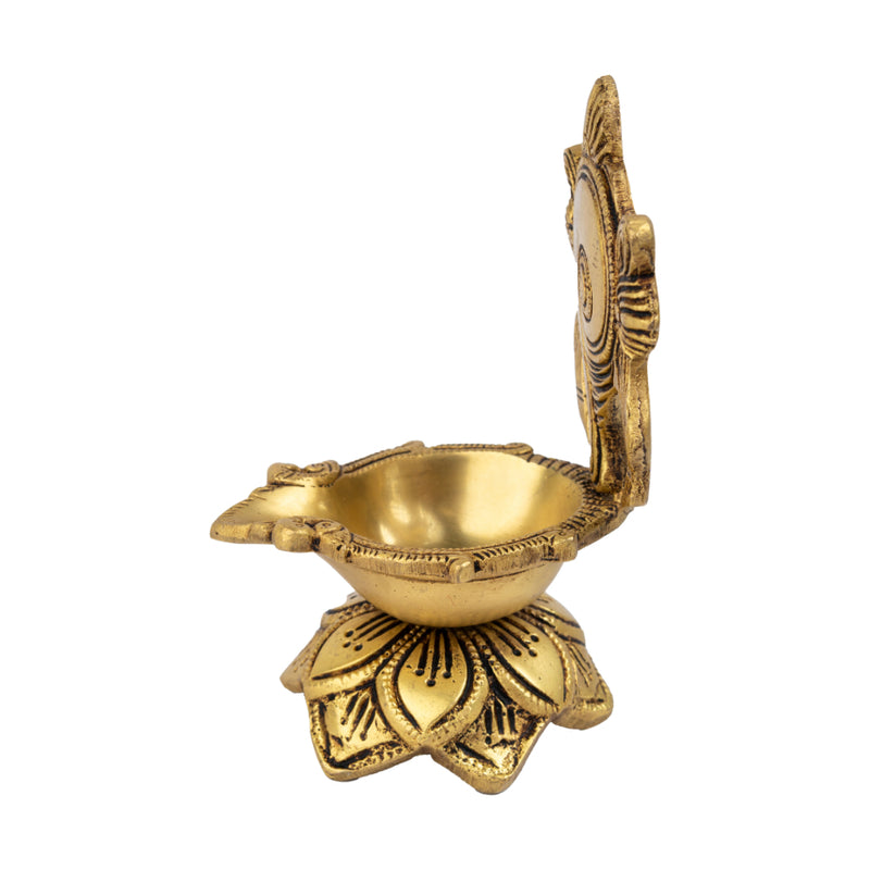 Brass Shank Diya - intricately designed brass oil lamp in the shape of a conch shell, golden finish, decorative home accent, symbolizes purity and spirituality, traditional Indian Diya, emits a radiant and calming glow, perfect for religious ceremonies and meditation, enhances spiritual ambiance and decor with a touch of serenity.