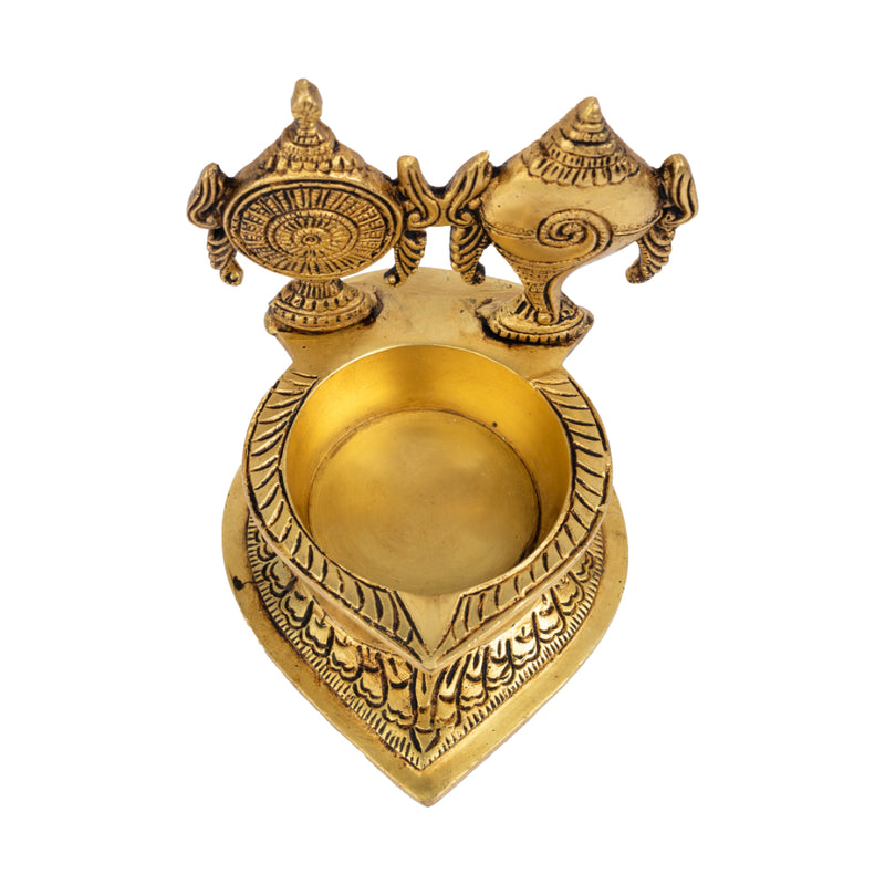 Brass Shank Chakra Diya - beautifully crafted brass oil lamp in the shape of a conch shell with chakra design, golden finish, decorative home accent, symbolizes purity and spiritual energy, traditional Indian Diya, emits a divine and serene glow, ideal for religious ceremonies and meditation, enhances spiritual ambiance and decor with a touch of sacredness.