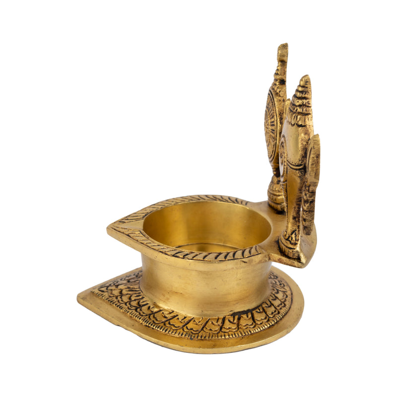 Brass Shank Chakra Diya - beautifully crafted brass oil lamp in the shape of a conch shell with chakra design, golden finish, decorative home accent, symbolizes purity and spiritual energy, traditional Indian Diya, emits a divine and serene glow, ideal for religious ceremonies and meditation, enhances spiritual ambiance and decor with a touch of sacredness.