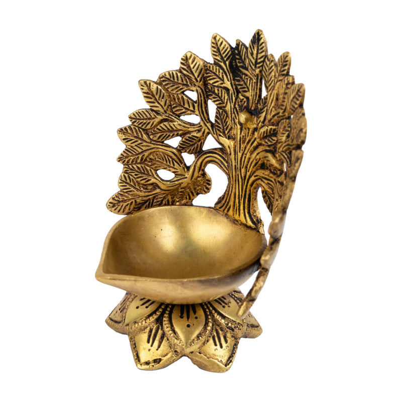 Brass Tree Diya - meticulously designed brass oil lamp in the shape of a tree, golden finish, decorative home accent, symbolizes growth and prosperity, traditional Indian Diya, emits a warm and radiant glow, perfect for festive celebrations and spiritual rituals, enhances spiritual ambiance and decor with a touch of natural beauty.