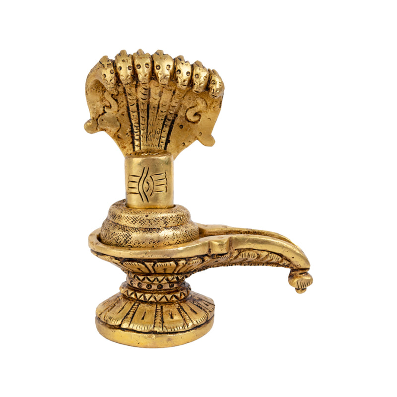 Brass Shivling - intricately crafted brass Shivling (Shiva Lingam), golden finish, sacred symbol of Lord Shiva, perfect for worship and meditation, ideal for creating a divine ambiance in your home or temple, symbolizes the cosmic energy and represents the formless nature of Lord Shiva, enhances spiritual practices and fosters a sense of reverence, a beautiful and sacred addition to your collection of brass artifacts.