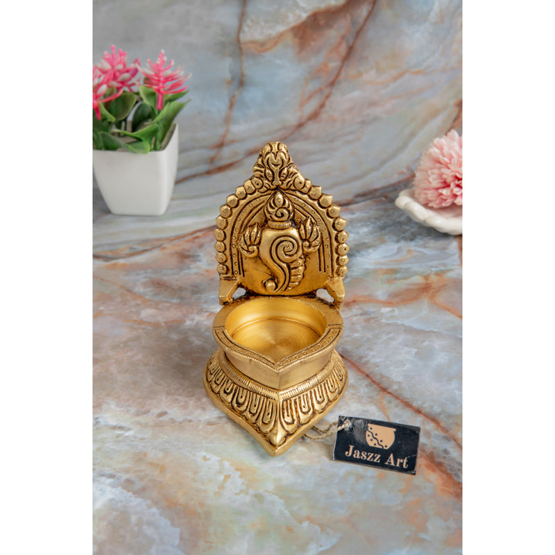 Brass Shank Diya - intricately designed brass oil lamp in the shape of a conch shell, golden finish, decorative home accent, symbolizes purity and spirituality, traditional Indian Diya, emits a radiant and calming glow, perfect for religious ceremonies and meditation, enhances spiritual ambiance and decor with a touch of serenity.