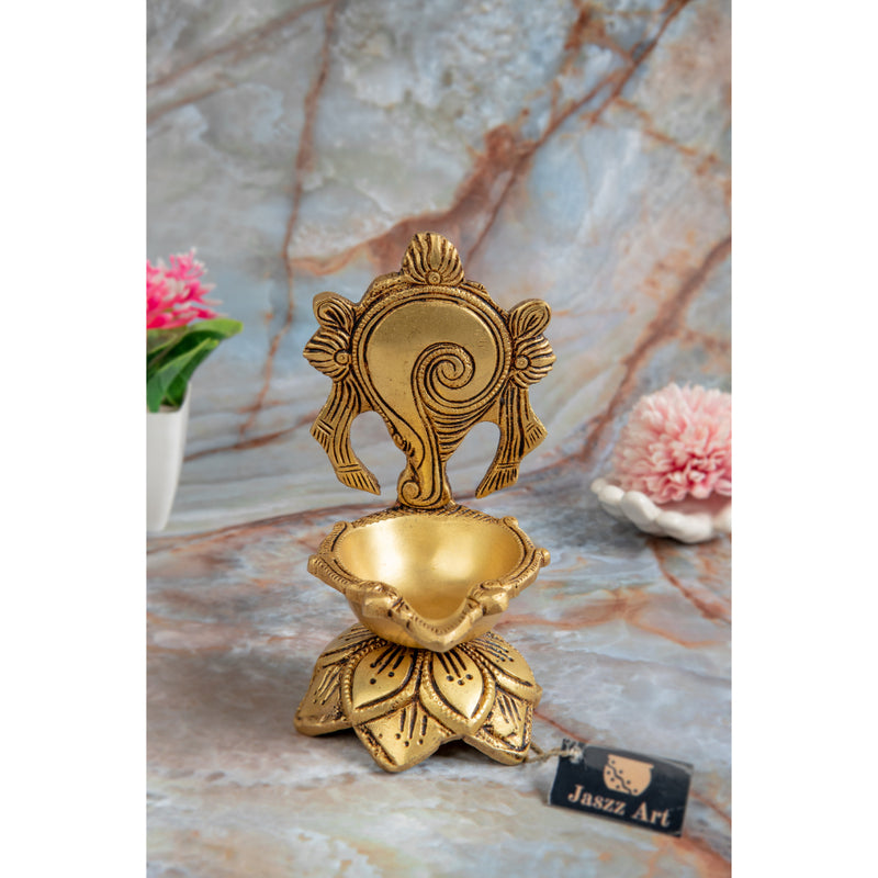 Brass Shank Diya - intricately designed brass oil lamp in the shape of a conch shell, golden finish, decorative home accent, symbolizes purity and spirituality, traditional Indian Diya, emits a radiant and calming glow, perfect for religious ceremonies and meditation, enhances spiritual ambiance and decor with a touch of serenity.