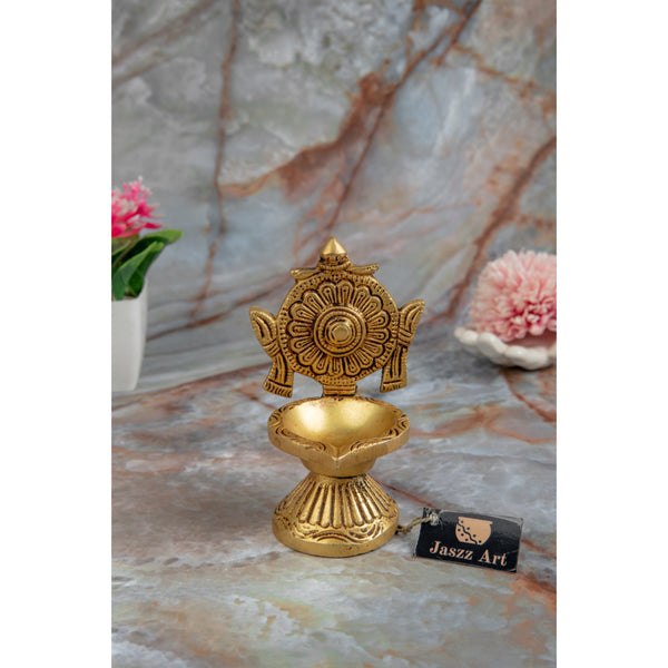 Brass Chakra Diya - beautifully crafted brass oil lamp with Chakra design, golden finish, decorative home accent, traditional Indian Diya, symbolizes spiritual energy and balance, emits a radiant and peaceful glow, perfect for rituals and meditation, enhances spiritual ambiance and decor