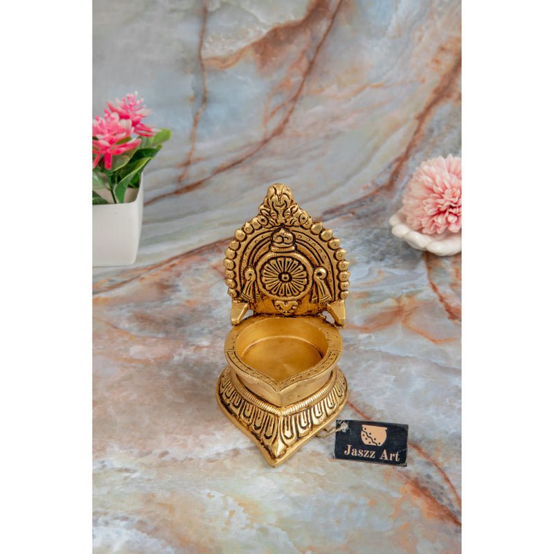 Brass Chakra Diya - beautifully crafted brass oil lamp with Chakra design, golden finish, decorative home accent, traditional Indian Diya, symbolizes spiritual energy and balance, emits a radiant and peaceful glow, perfect for rituals and meditation, enhances spiritual ambiance and decor