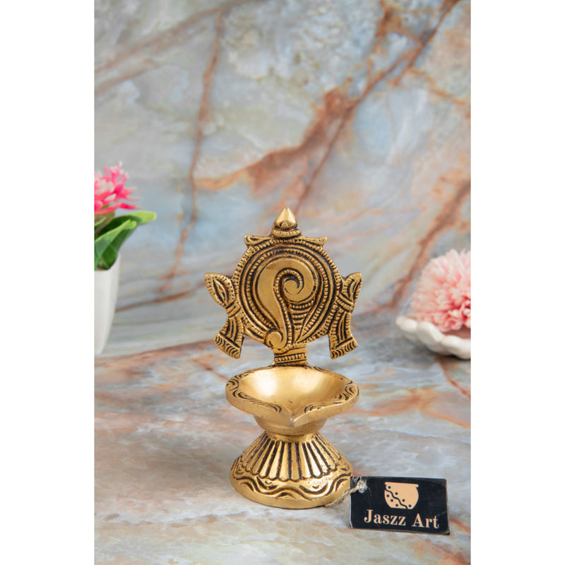 Brass Shank Diya - intricately designed brass oil lamp in the shape of a conch shell, golden finish, decorative home accent, symbolizes purity and spirituality, traditional Indian Diya, emits a radiant and calming glow, perfect for religious ceremonies and meditation, enhances spiritual ambiance and decor with a touch of serenity.