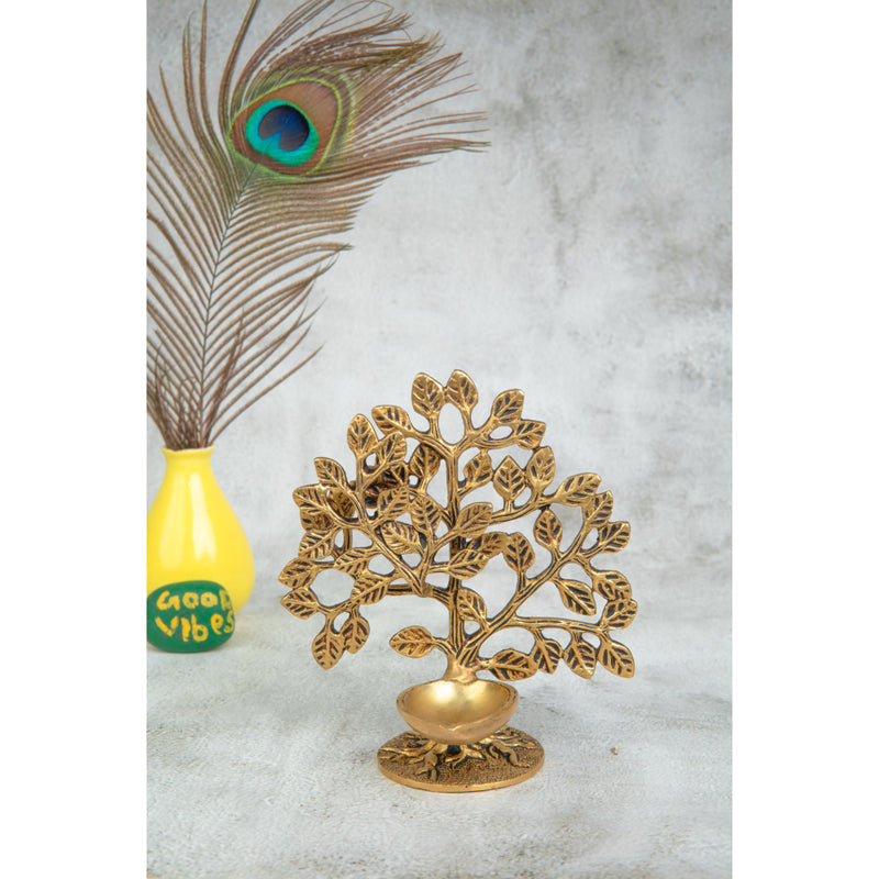 Brass Tree Diya - meticulously designed brass oil lamp in the shape of a tree, golden finish, decorative home accent, symbolizes growth and prosperity, traditional Indian Diya, emits a warm and radiant glow, perfect for festive celebrations and spiritual rituals, enhances spiritual ambiance and decor with a touch of natural beauty.