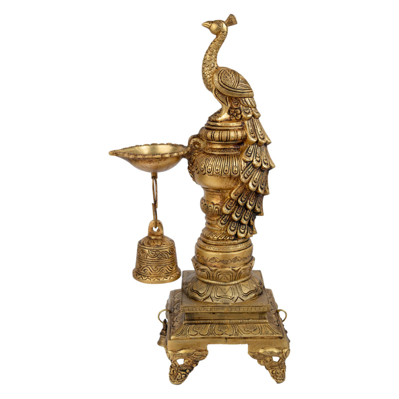 Brass peacock parrot Diya - exquisitely crafted brass oil lamp in the shape of a peacock with parrot motifs, golden finish, decorative home accent, fusion of elegance and vibrancy, traditional Indian Diya, emits a captivating and auspicious glow, perfect for festive occasions and religious ceremonies, enhances spiritual ambiance and decor with a touch of artistic brilliance.