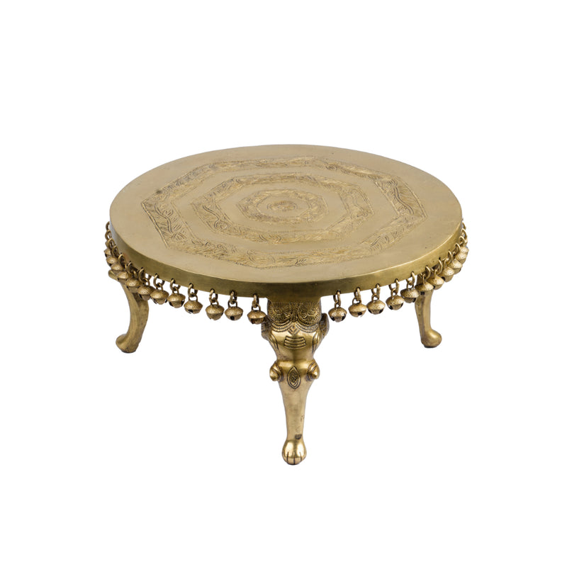 Brass Chowki - intricately carved brass platform, golden finish, perfect for placing deities or sacred objects during religious ceremonies and rituals, enhances the sanctity and beauty of the worship space, symbolizes stability and divine presence, adds a touch of elegance to your home puja setup, a valuable and ornamental addition to your collection of brass religious artifacts and decor.