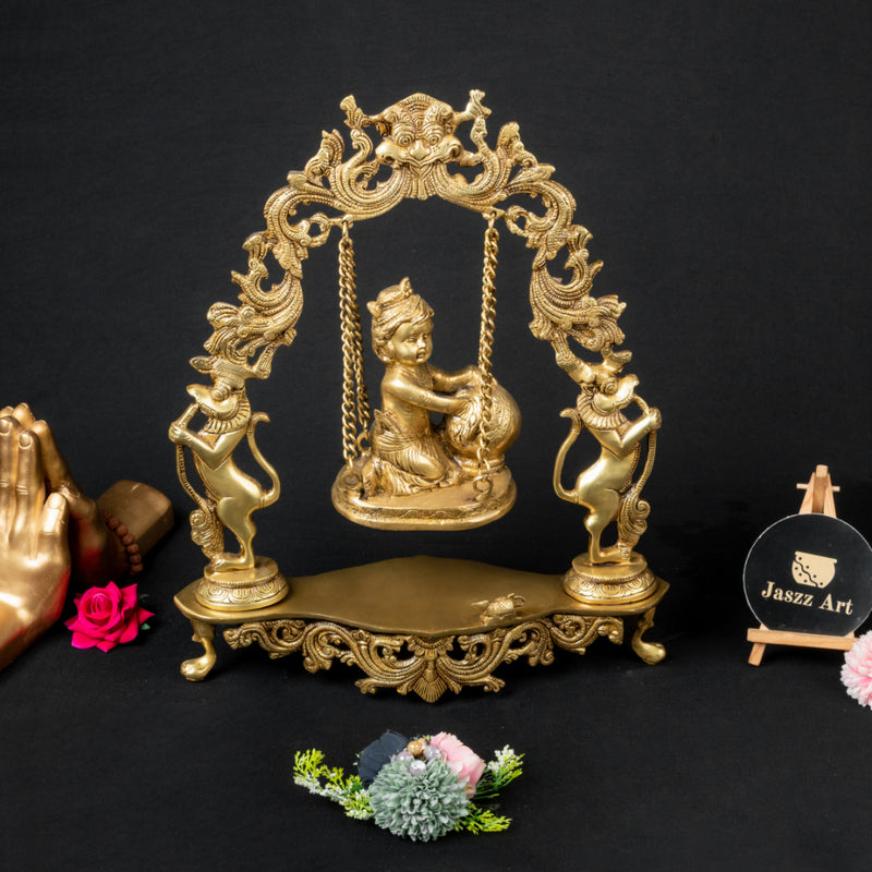 Brass Laddu Gopal Urli - exquisitely crafted brass decorative bowl featuring the deity Laddu Gopal, golden finish, traditional Indian Urli, auspicious home accent, ideal for floating flower petals or candles, symbolizes devotion and divine blessings, adds a touch of spiritual charm and cultural beauty to any space, perfect for creating a serene ambiance and enhancing interior decor, a cherished piece for devotees and collectors, suitable for both indoor and outdoor settings.